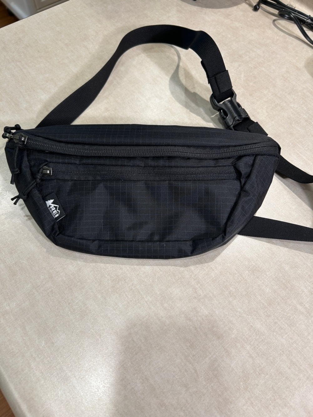 REI 5 pocket Black Waist Pack - Compact Sling for hiking, biking or on the go.